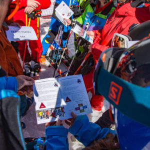 group of people looking at a pamphlet