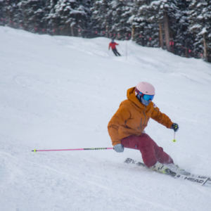 female skiing downhill