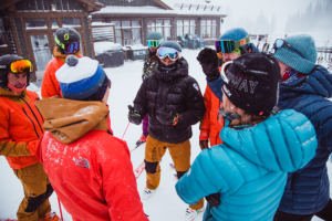 group of people in snow gear talking