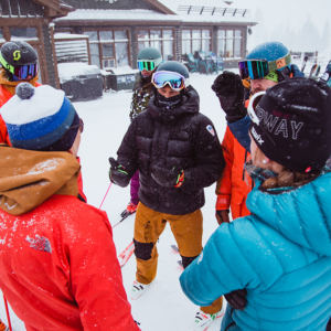 group of people in snow gear talking