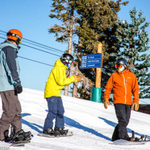 people talking in snowboard gear