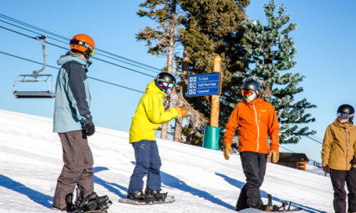 people talking in snowboard gear