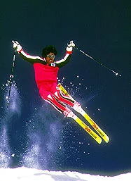 Person jumping in the air on skis