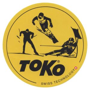 round yellow sticker with word TOKO and skiers